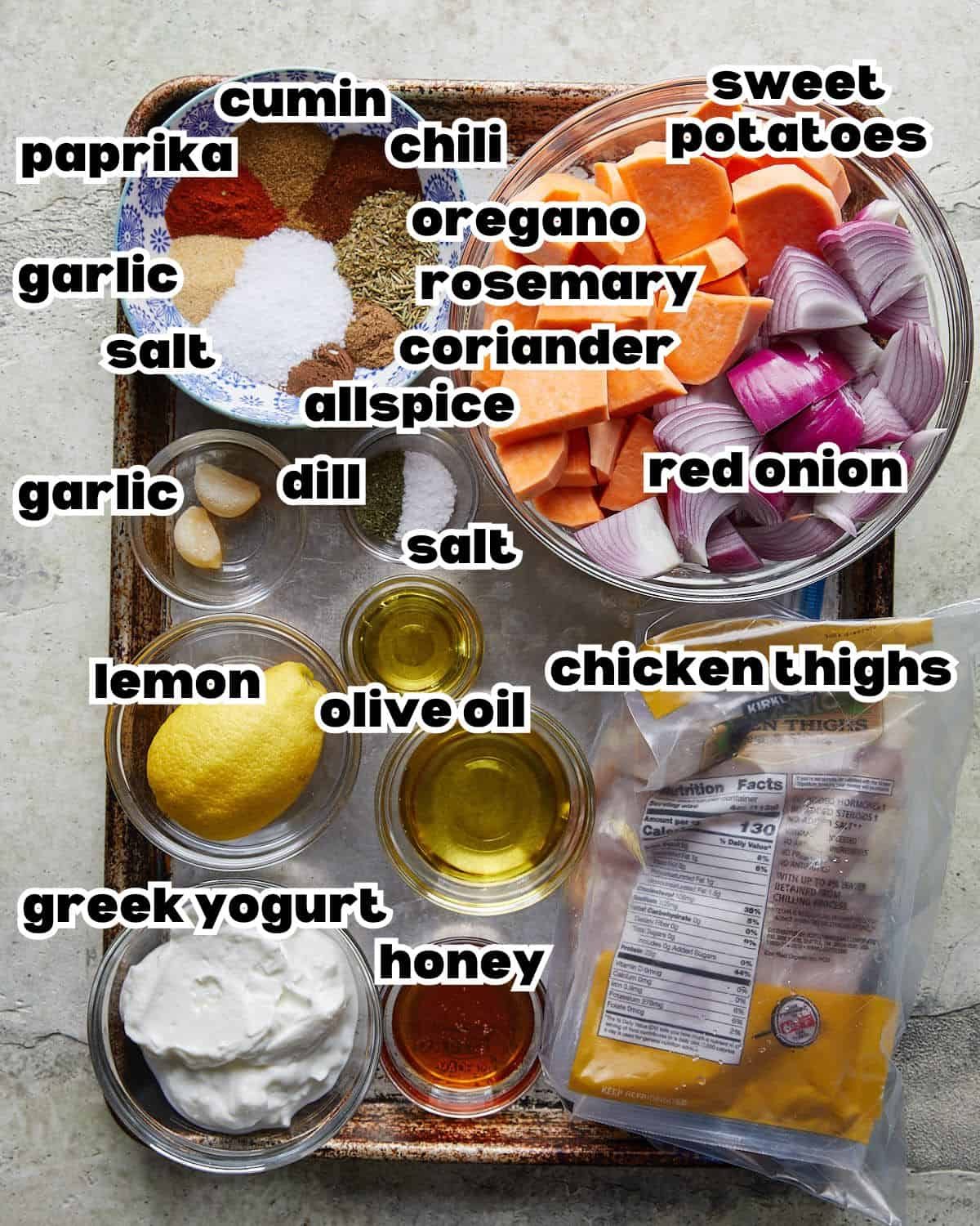 Overhead image of ingredients needed to make sheet pan chicken and sweet potatoes.