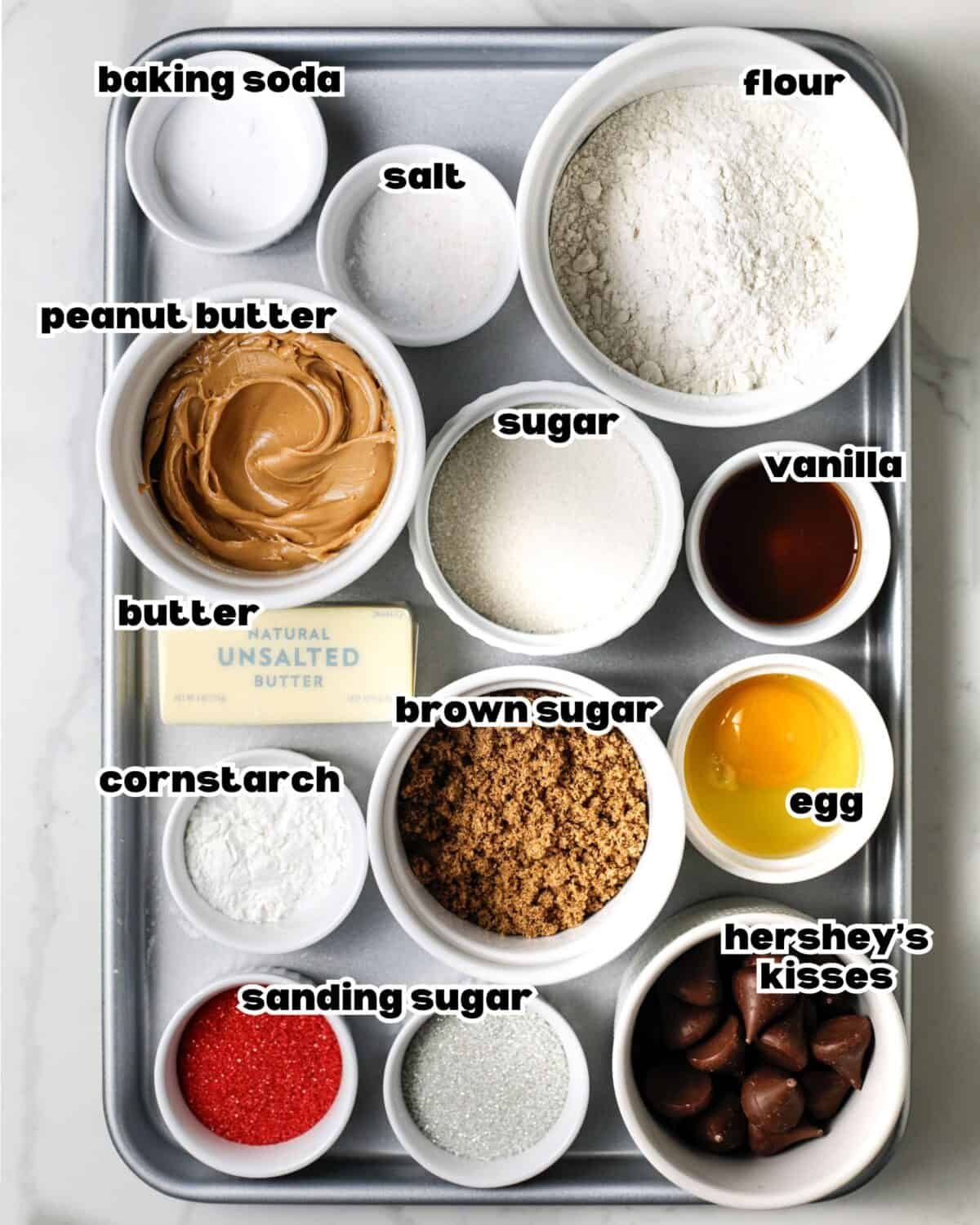 Overhead image of ingredients needed for Christmas peanut butter blossoms.