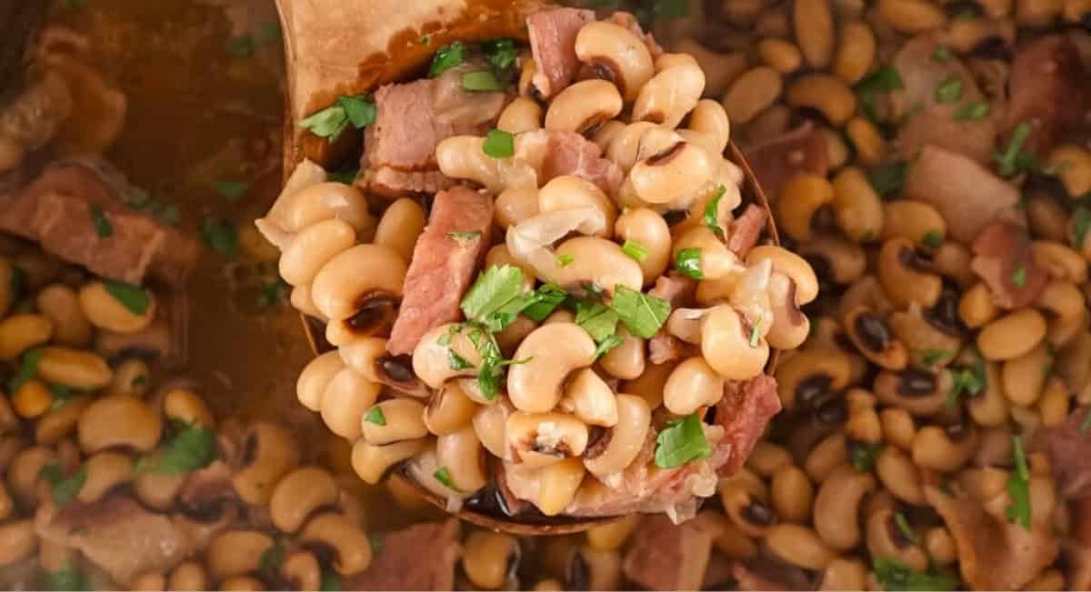 Overhead image of Instant Pot black eyed peas in wooden spoon.