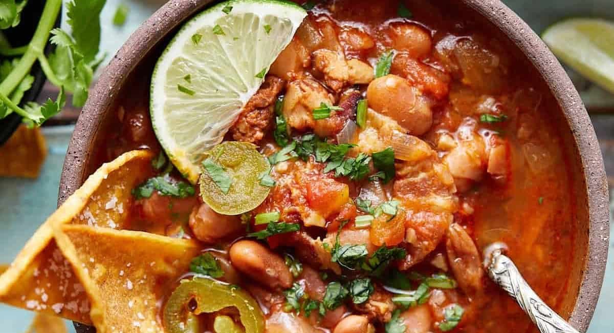 Overhead image of Instant Pot charro beans with garnish.