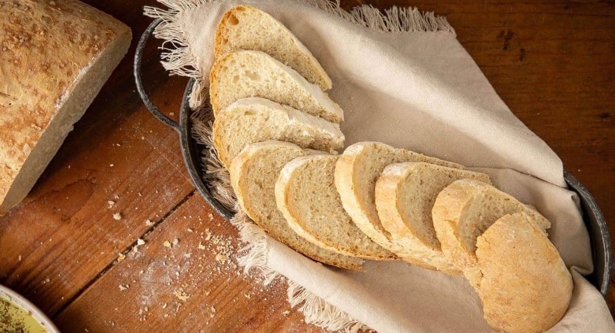 Overhead image of Italian bread cut into small pieces.