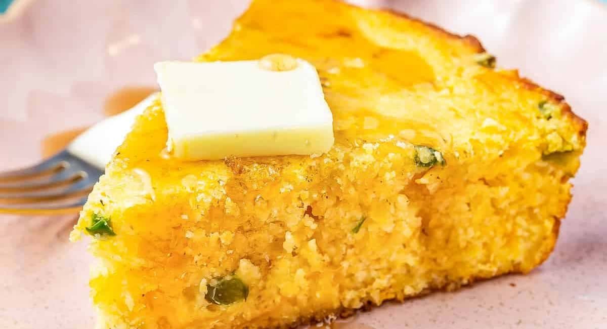 Up close image of jalapeno cornbread with butter on top.
