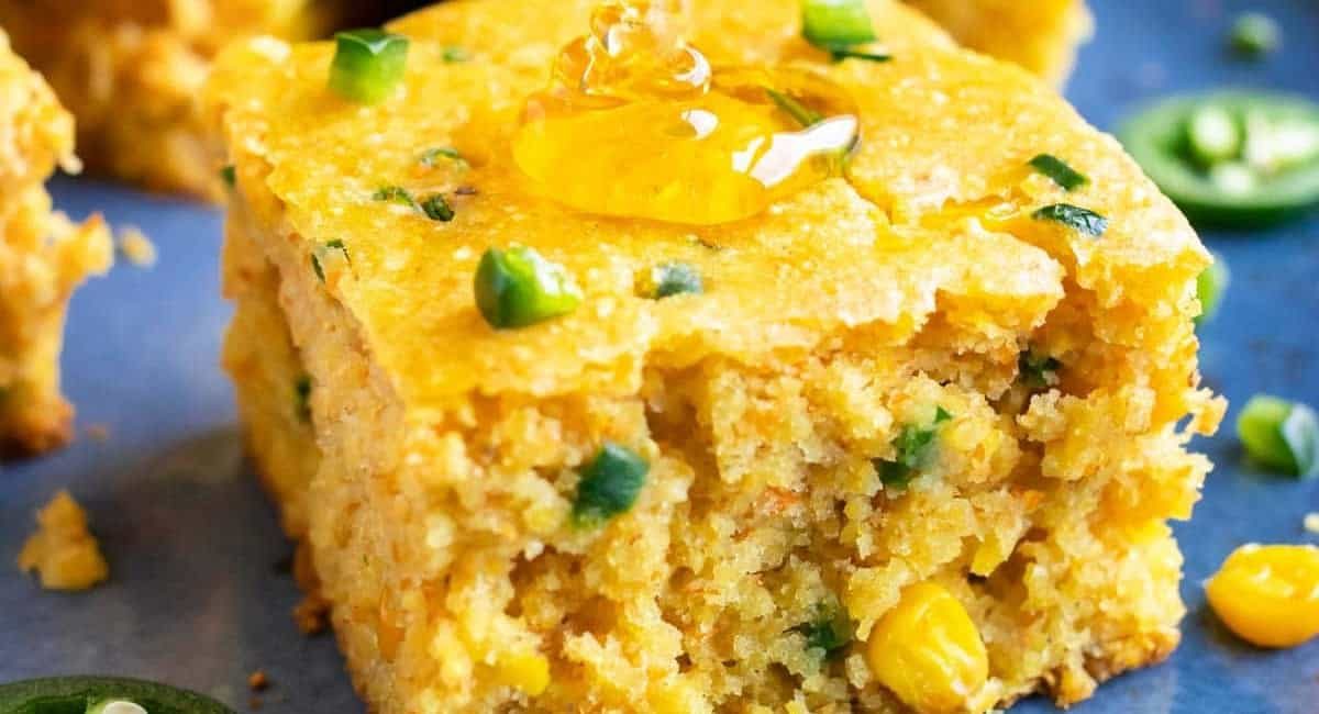 Up close image of jalapeno cornbread recipe with honey.