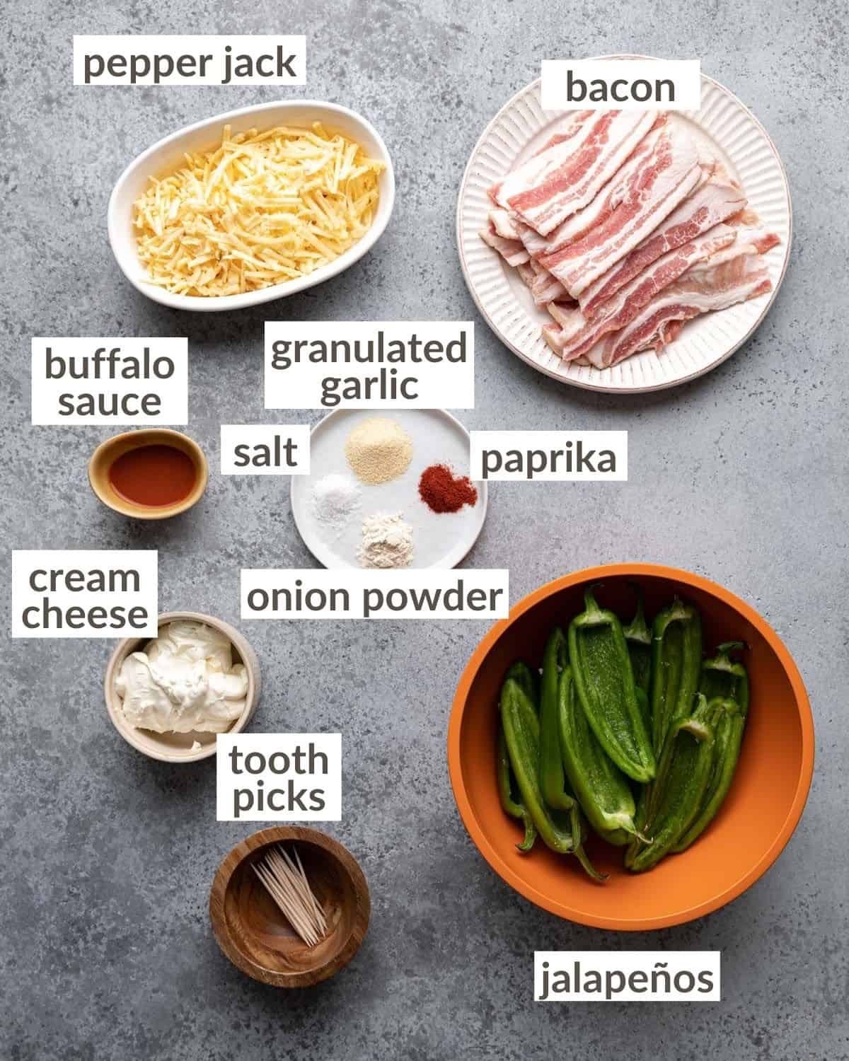 Overhead image of ingredients needed to make bacon wrapped jalapeno poppers.