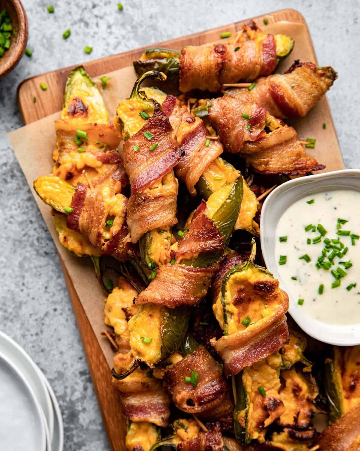 Overhead image of air fryer bacon wrapped jalapeno poppers.