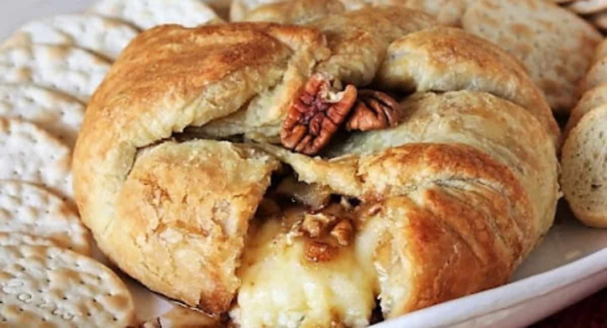 Up close image of Kahlua baked brie with crackers and bread.