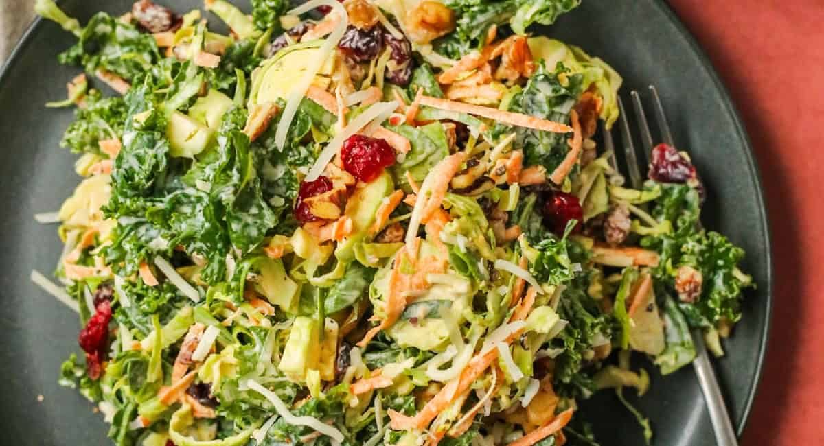Overhead image of kale and brussels sprout salad with creamy peppercorn dressing.