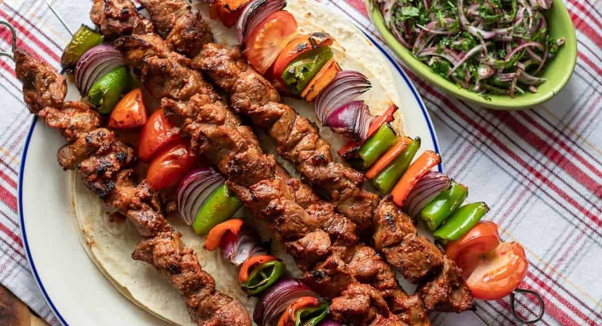Overhead image of lamb shish kebab.