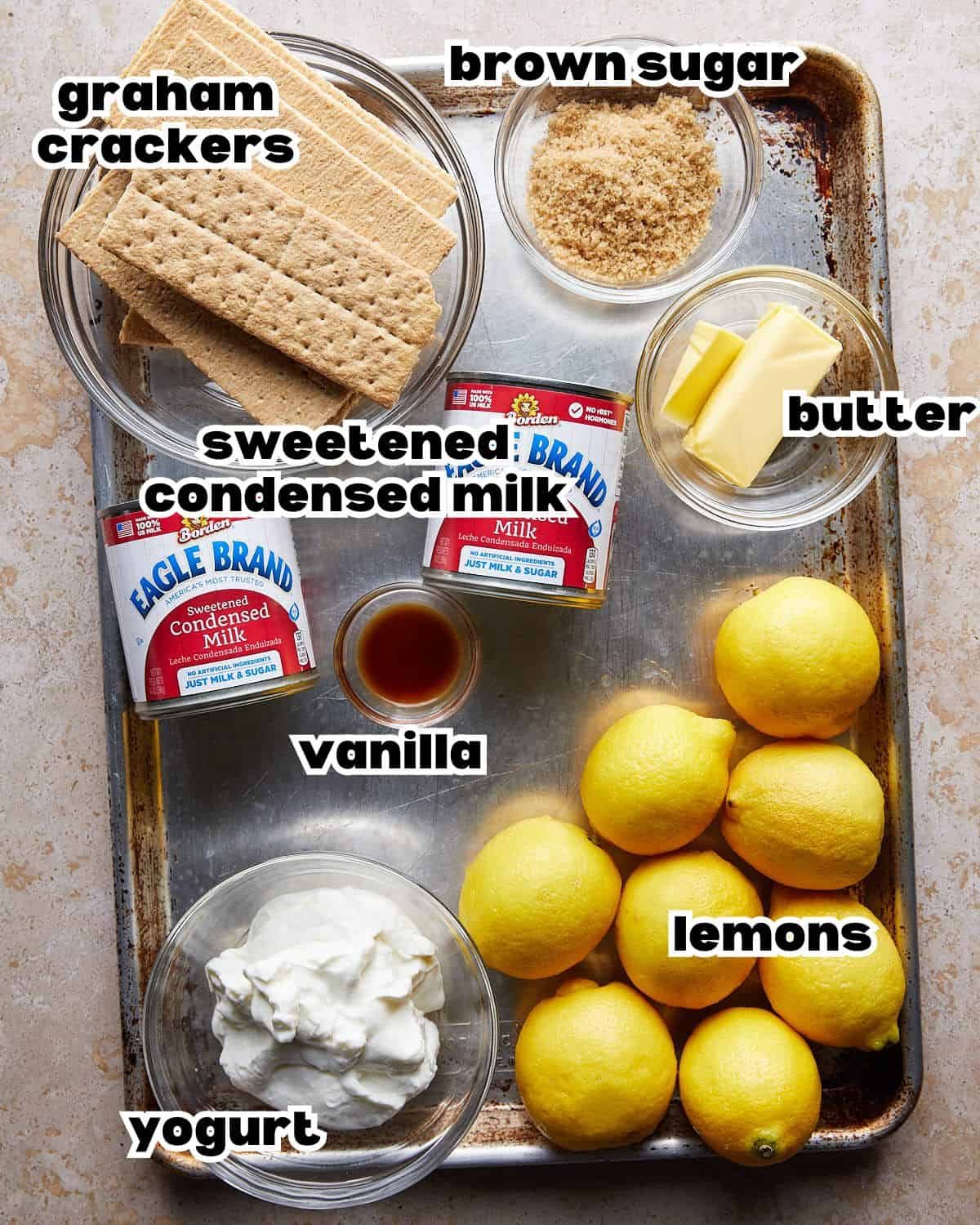 Overhead image of ingredients needed to make lemon bars with graham cracker crust.