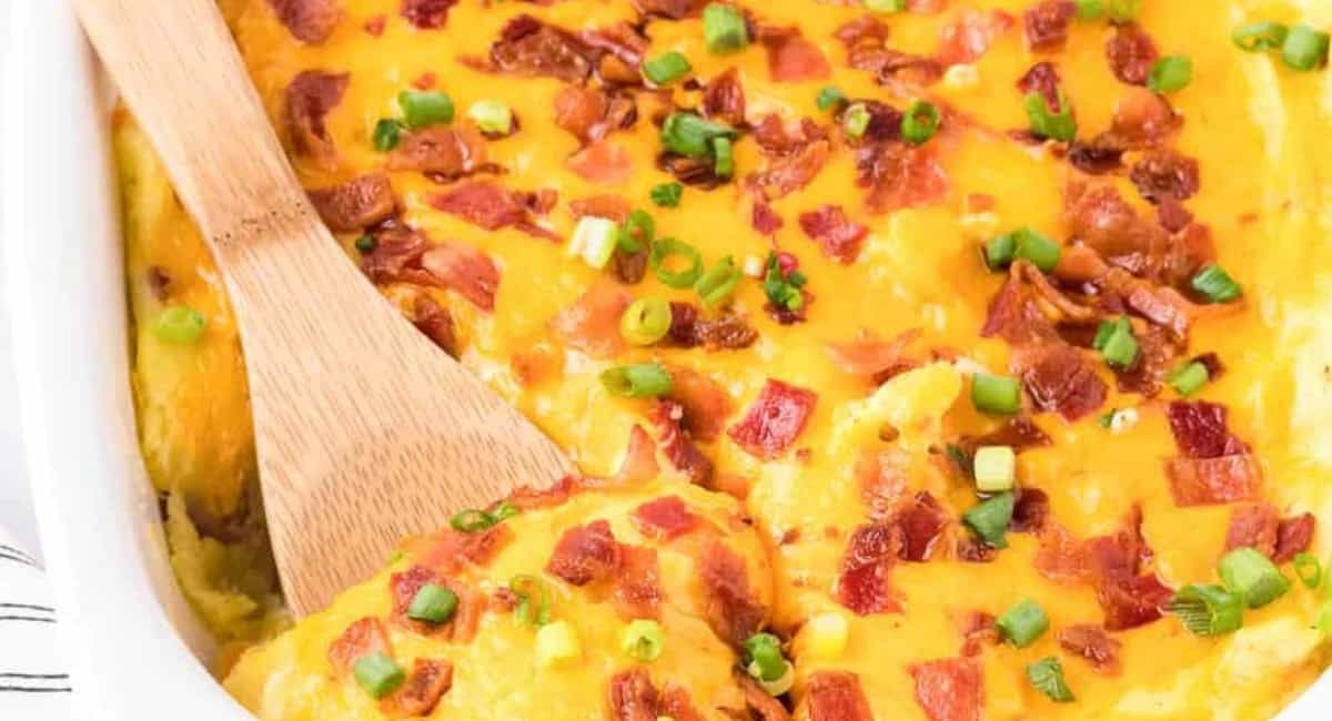 Overhead image of loaded mashed potato casserole with garnish.