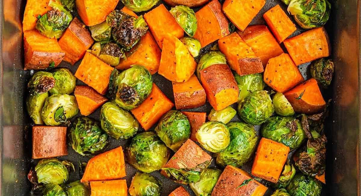 Overhead image of maple roasted sweet potatoes and brussels sprouts.