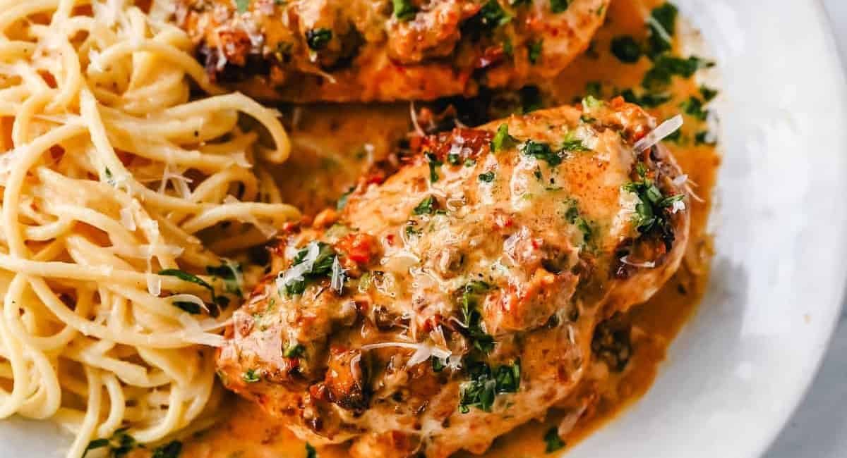 Overhead image of marry me chicken recipe with pasta on the side.