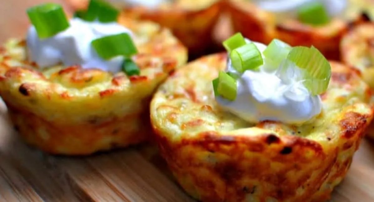 Up close image of mashed potato cakes with garnish.