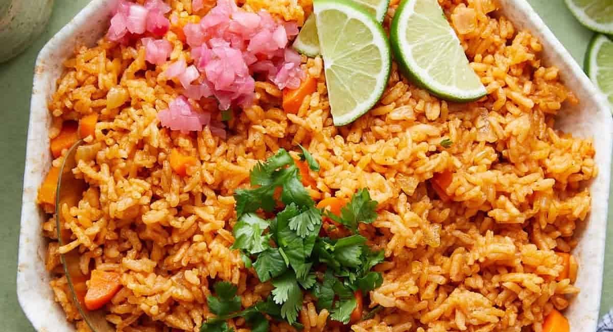 Overhead image of Mexican red rice recipe with garnish.