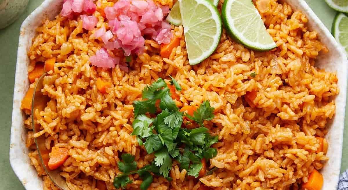 Overhead image of Mexican red rice with garnish.