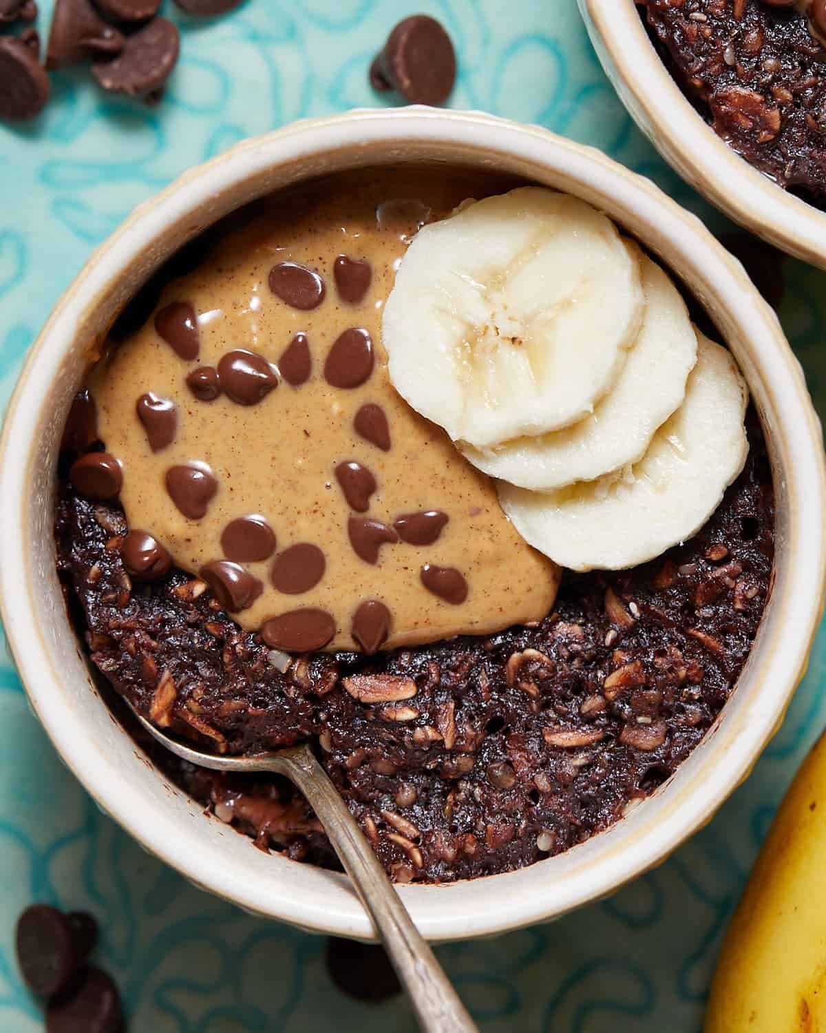 Up close overhead image of microwave baked oats with garnish.