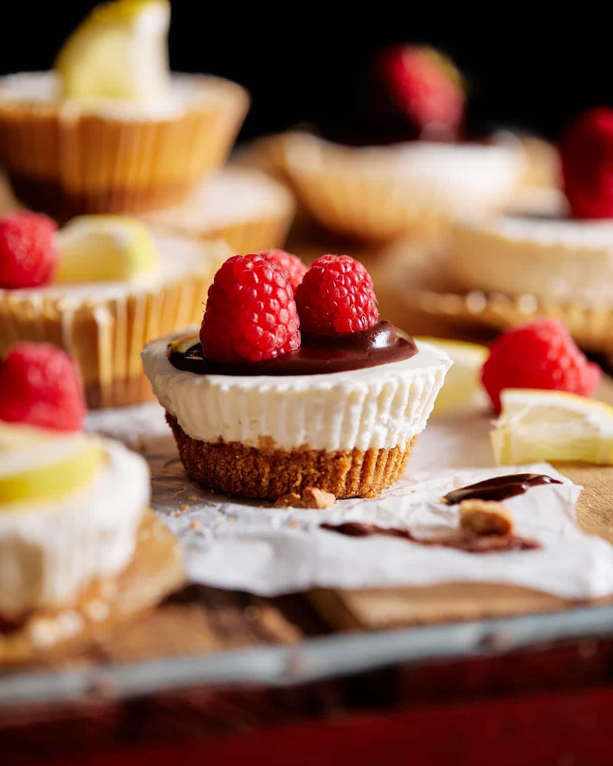No bake mini cheesecakes stacked with a variety of toppings.
