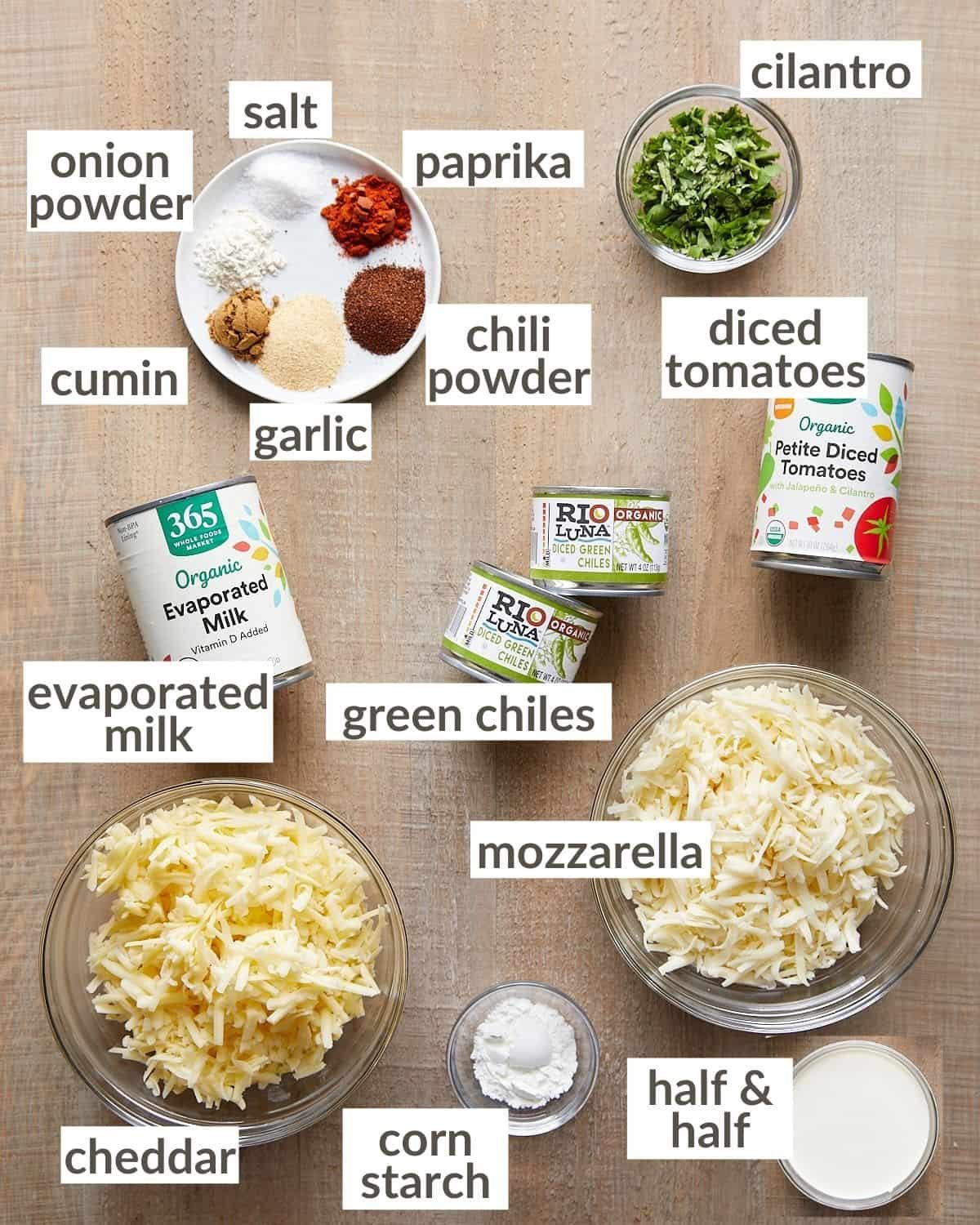 Overhead shot of ingredients needed to make mozzarella queso in glass bowls.