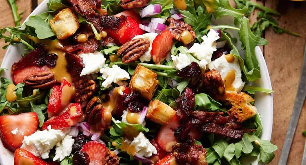 Overhead image of goat cheese salad with arugula.