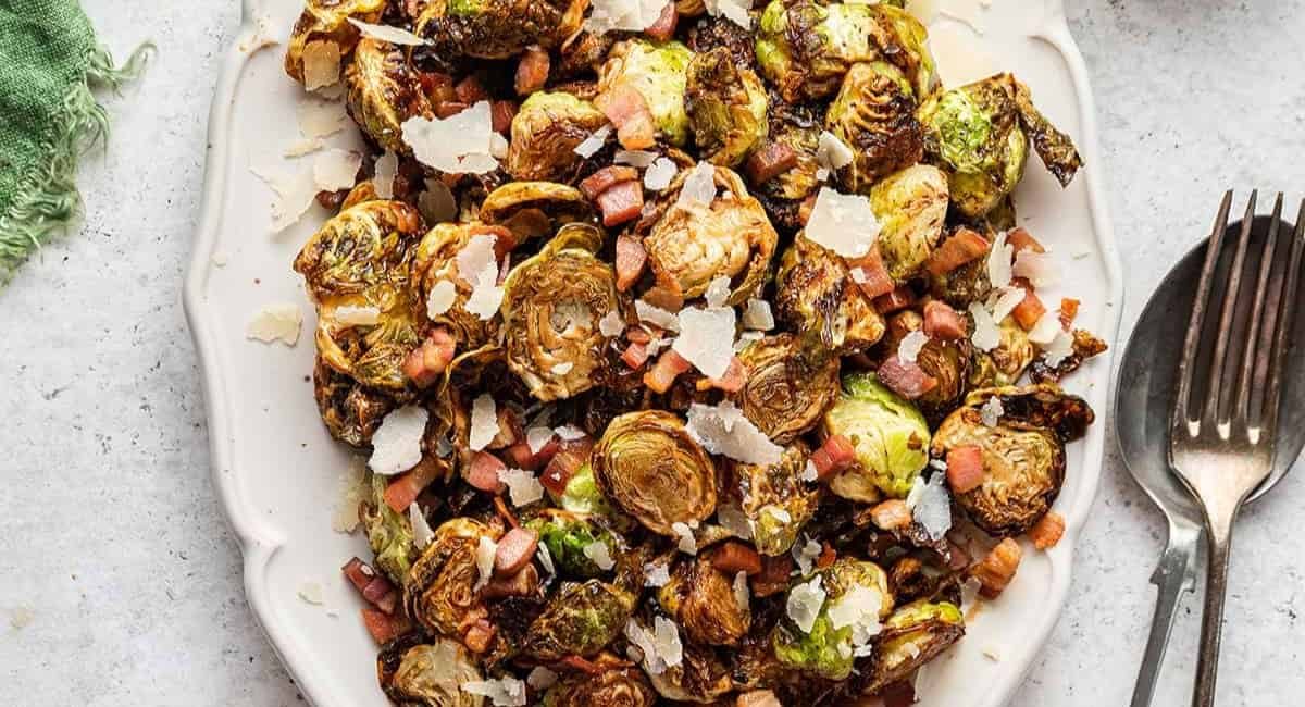 Overhead image of crispy balsamic brussels and pancetta with garnish.