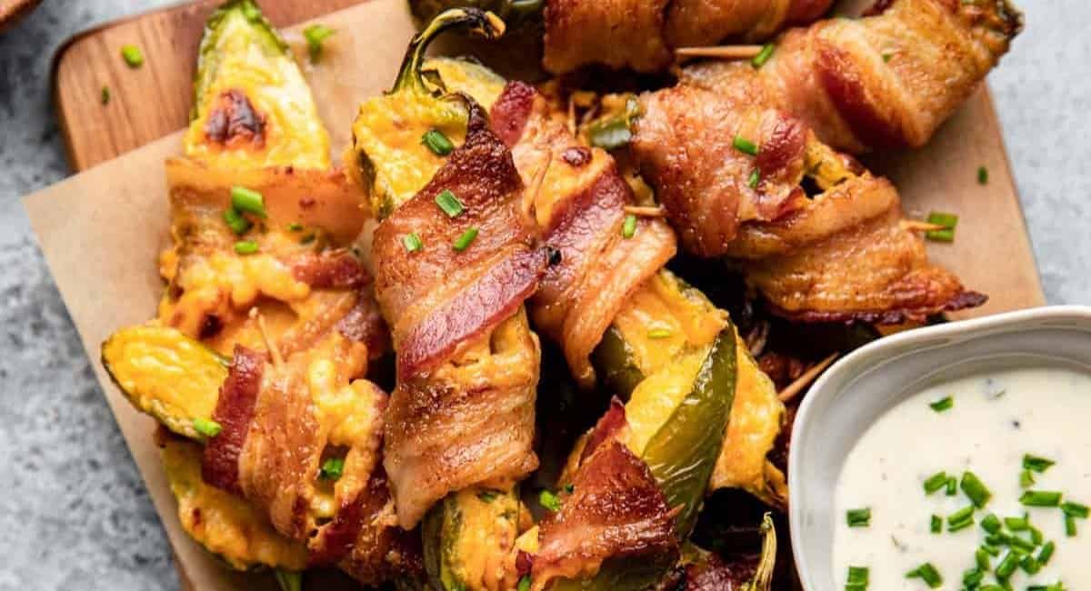 Overhead image of air fryer bacon wrapped jalapeno poppers.