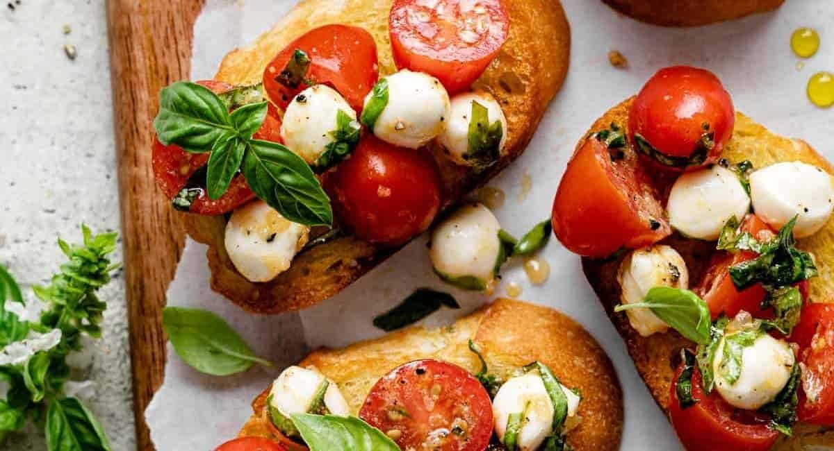 Overhead image of bruschetta with mozzarella.