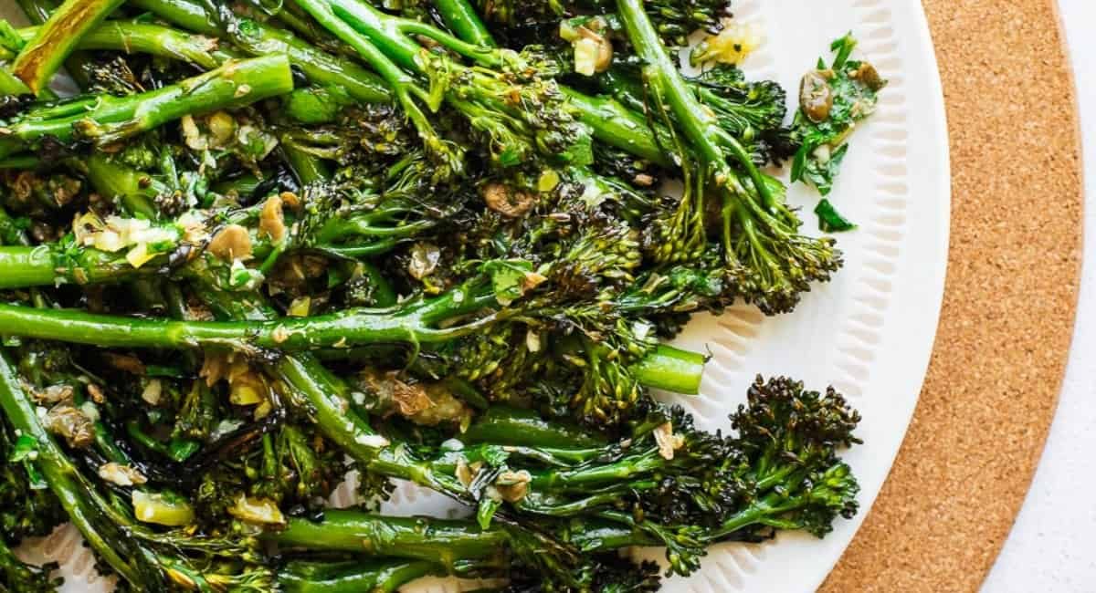 Up close image of charred broccolini with preserved lemon.