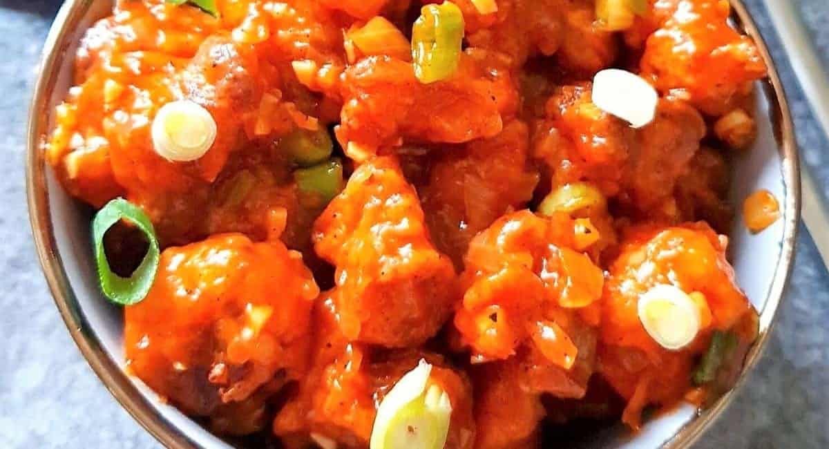 Overhead image of honey chili cauliflower with garnish.