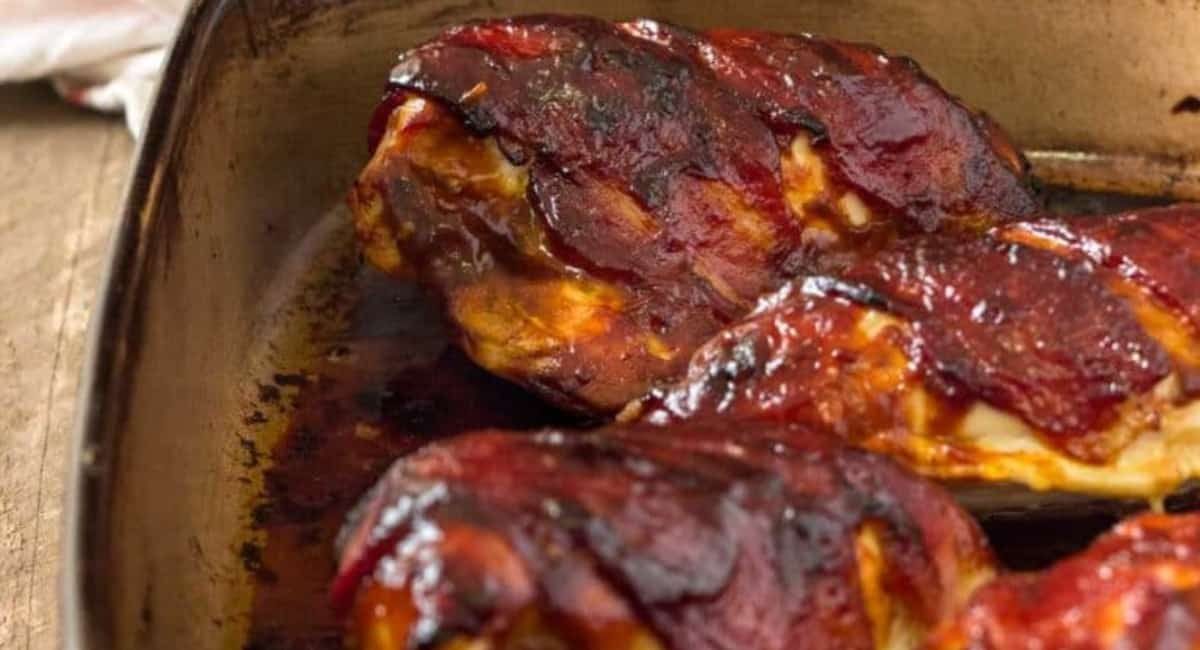 Up close image of bbq bacon wrapped chicken breast.