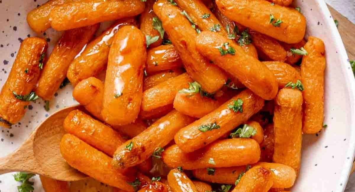 Overhead image of air fryer baby carrots in bowl.