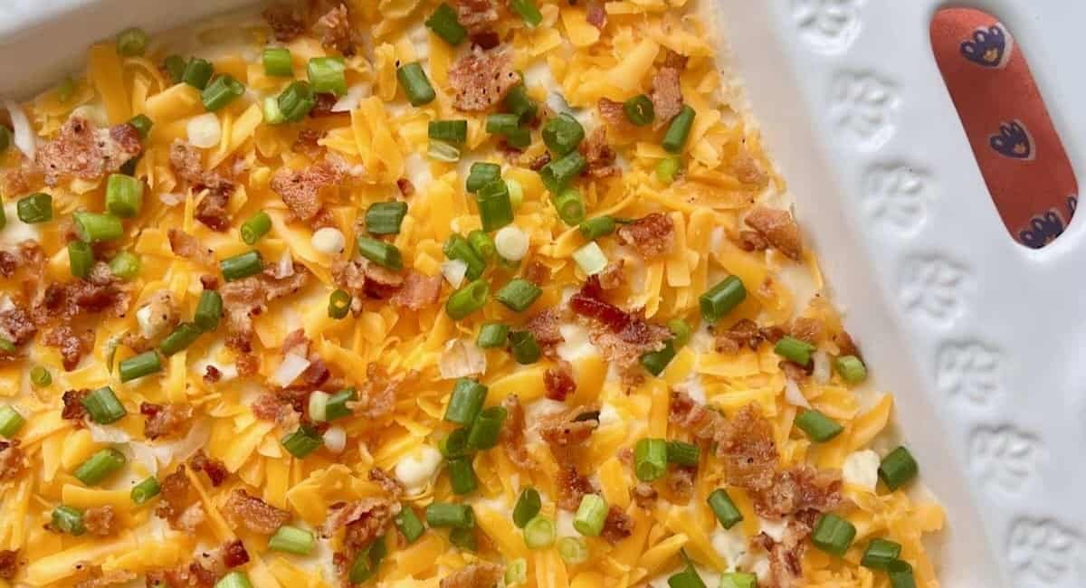 A photo of twice baked mashed potatoes in white dish.