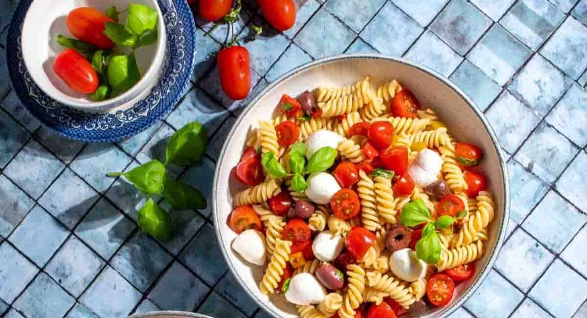 Overhead image of pasta fredda with garnish.