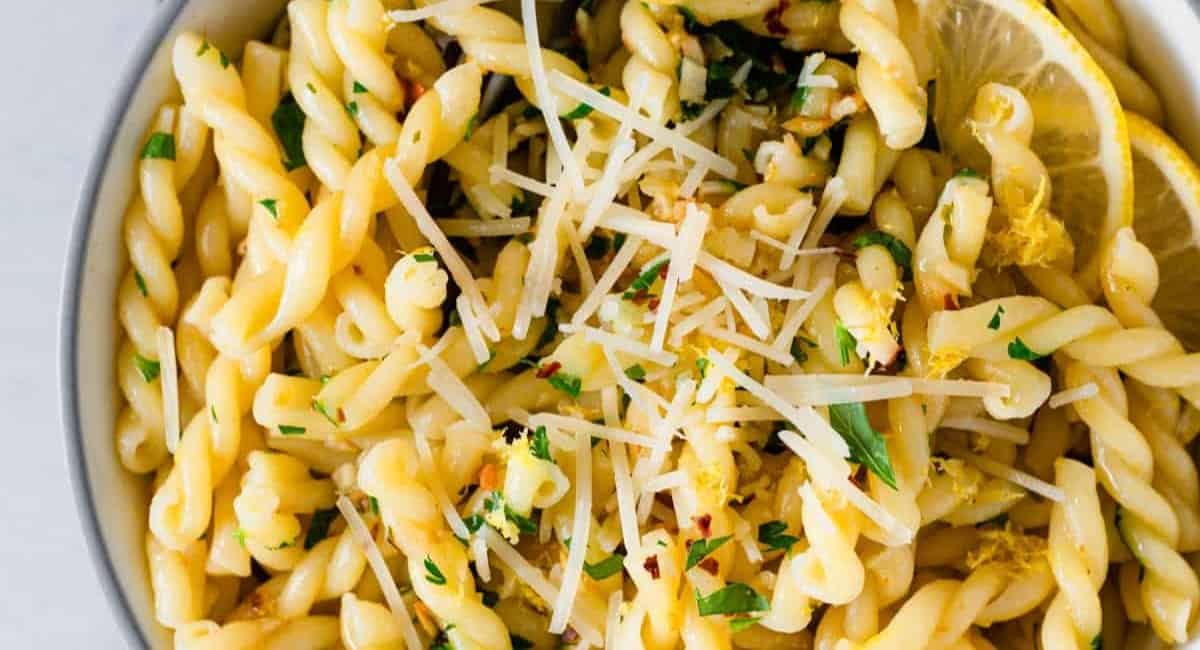 Up close image of gemelli pasta with lemon and garlic.