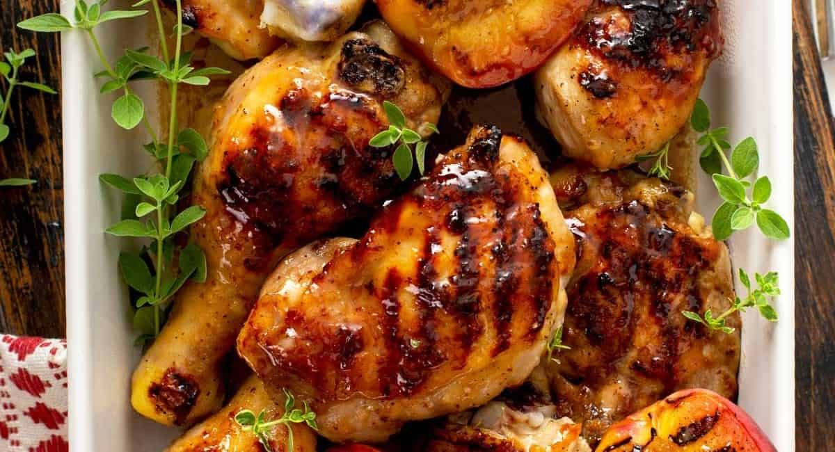 Overhead image of sticky chicken with peach glaze.