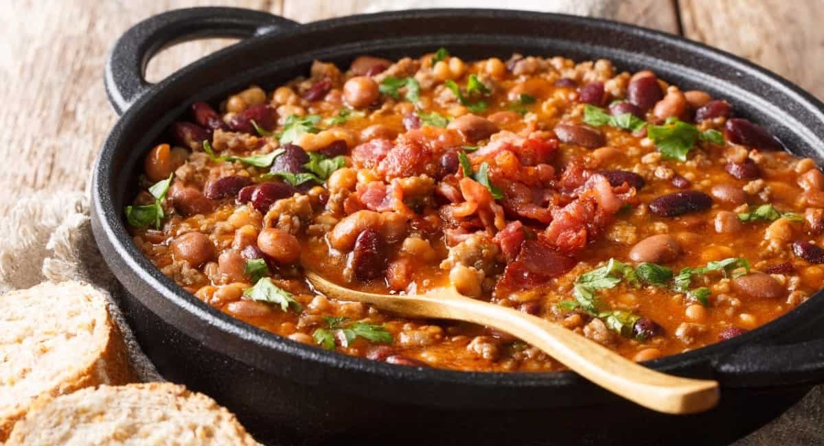 Overhead image of charro beans in black dish.