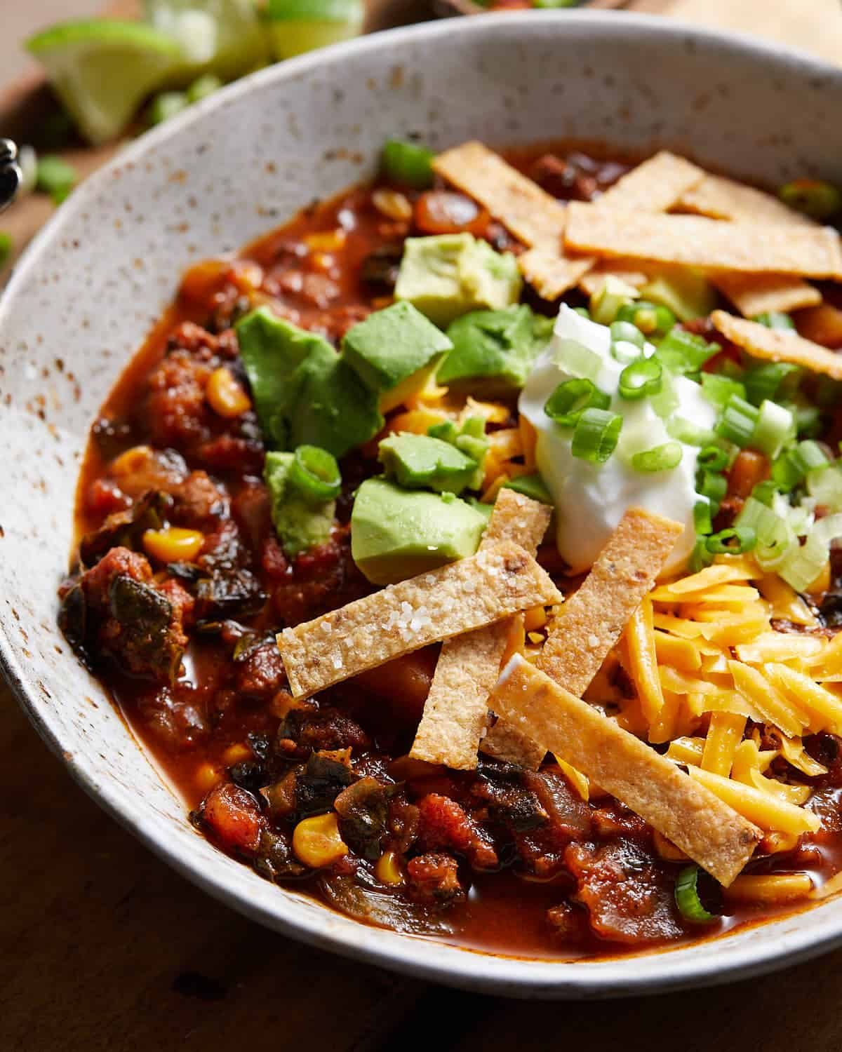 Up close overhead image of no bean turkey chili with garnish.