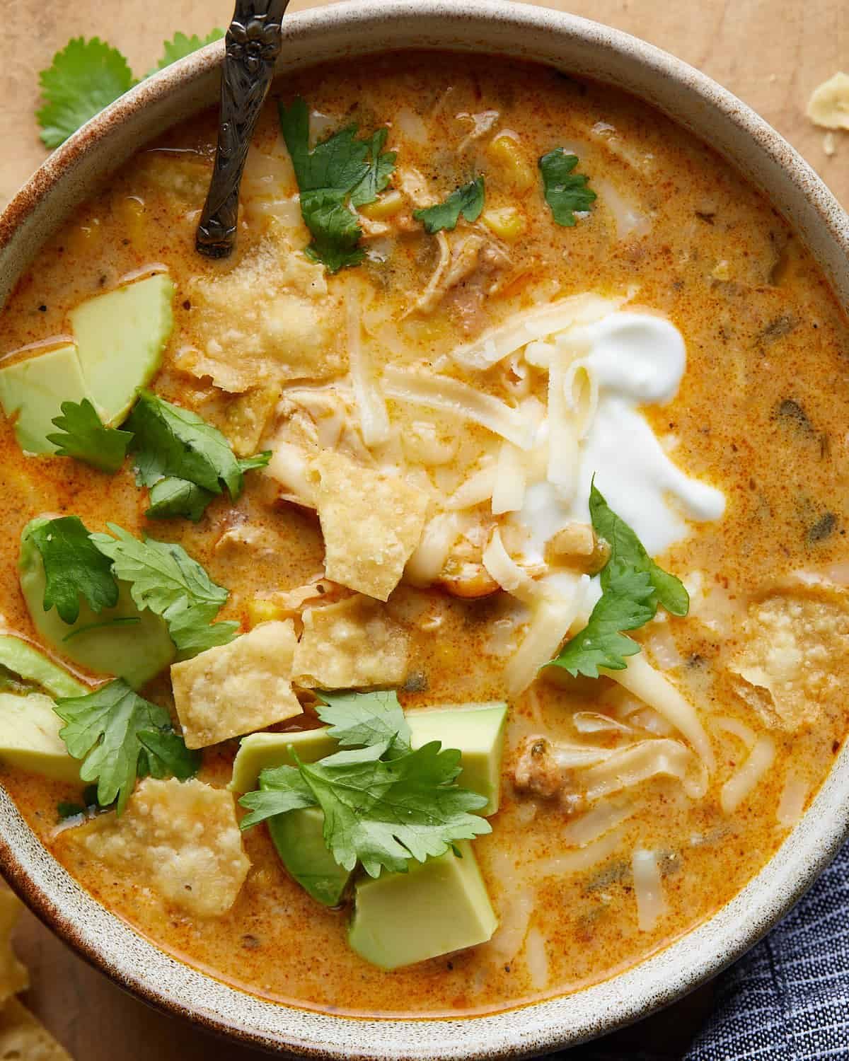 Up close image of no bean white chicken chili with garnish.