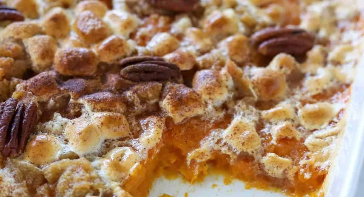 Overhead image of old fashioned sweet potato casserole with marshmallows and pecans.