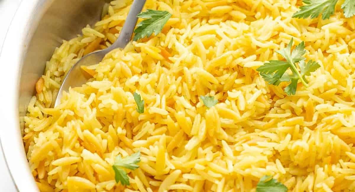Overhead image of rice pilaf with garlic and herbs.
