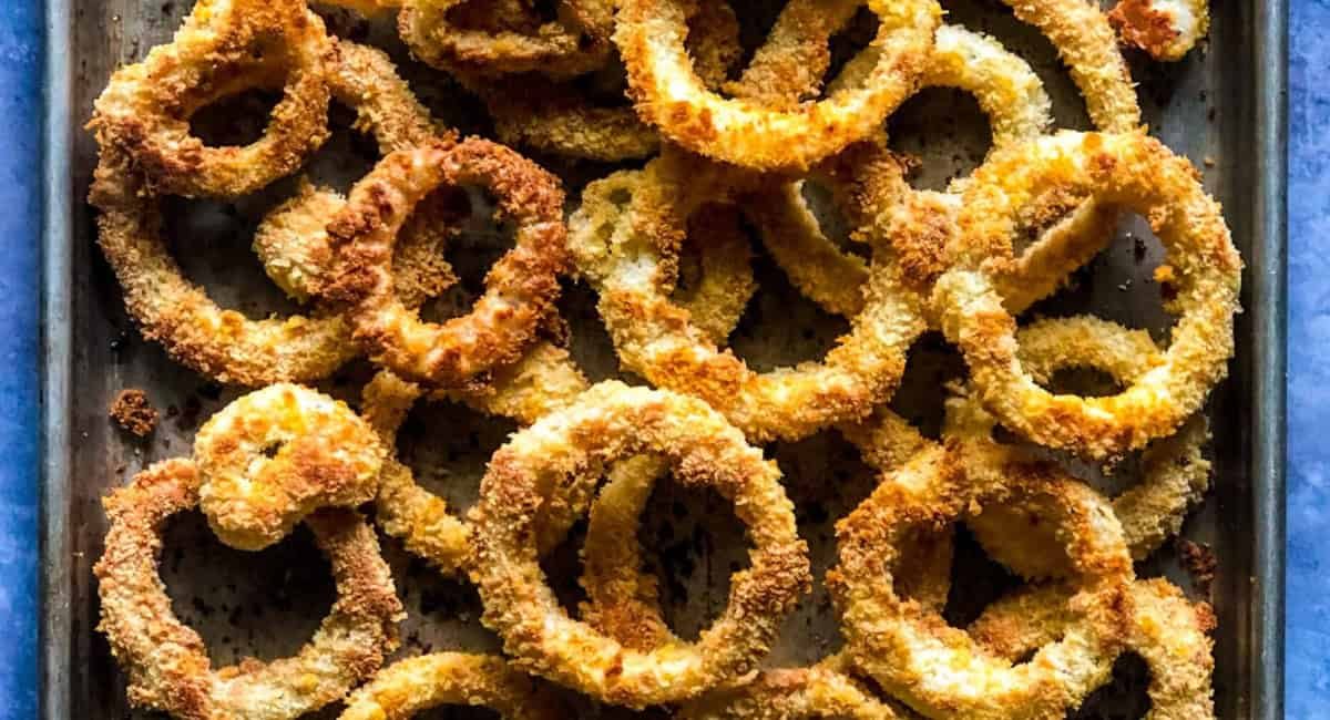 Overhead image of oven baked onion rings.