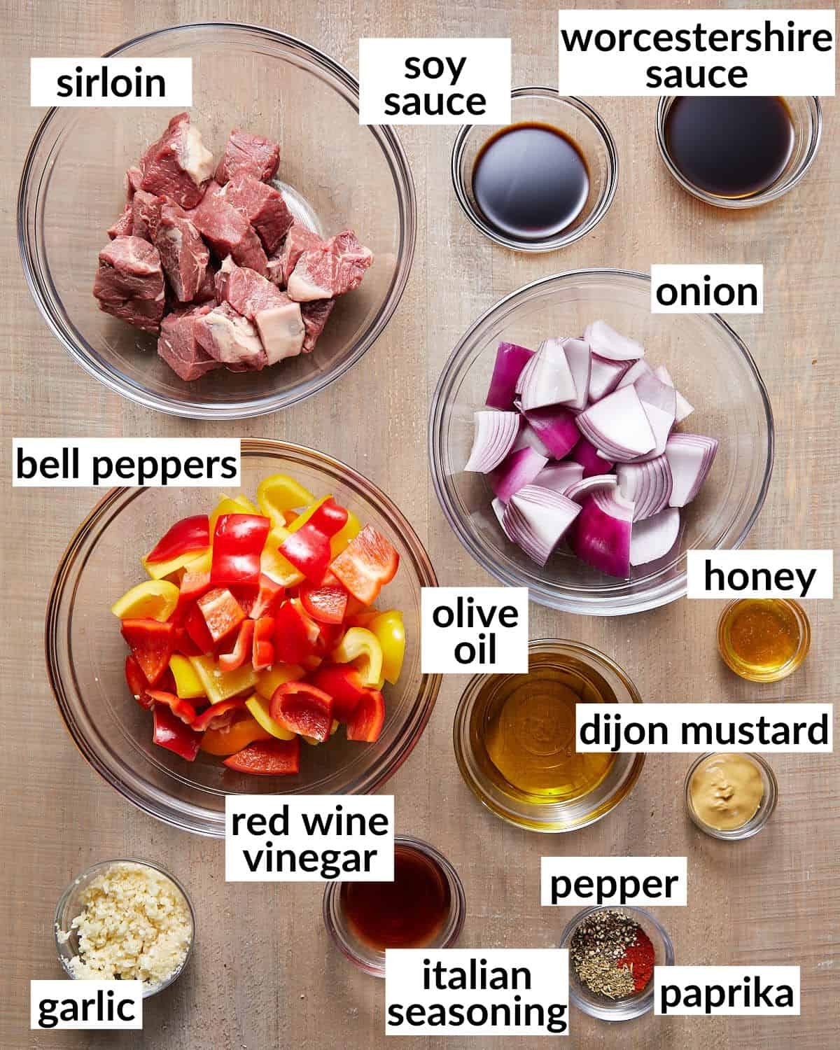 Overhead image of ingredients needed for beef kabobs.
