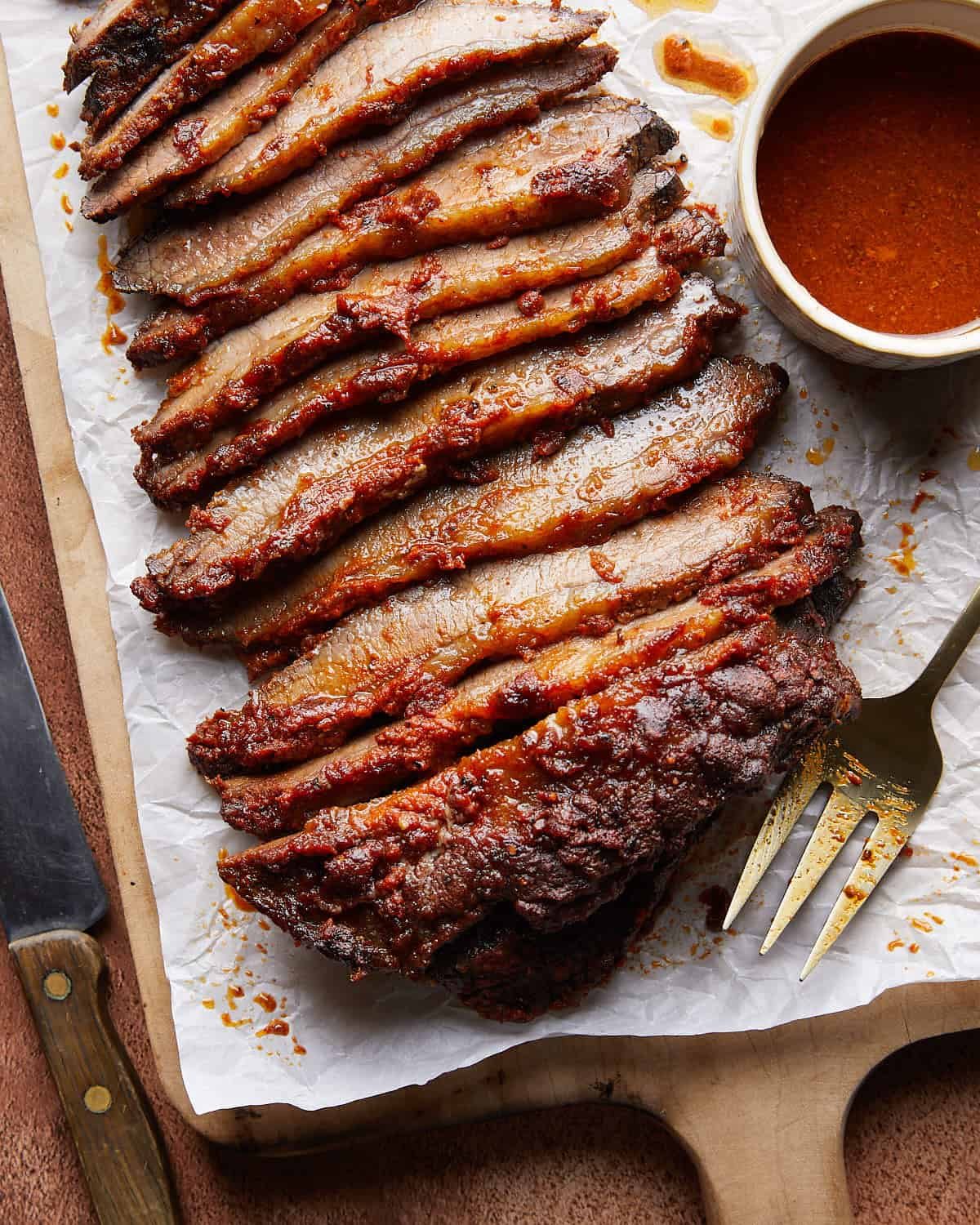 Overhead image of oven baked brisket with sauce.