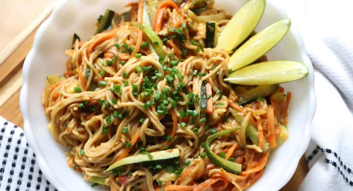Overhead image of vegetable ramen pad thai with garnish.