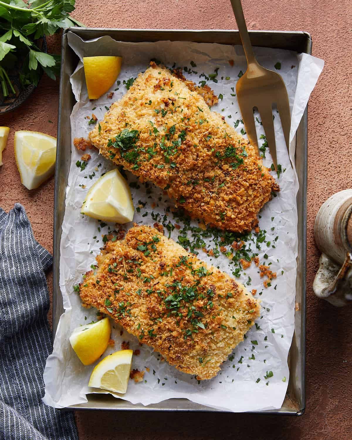 Overhead image of panko crusted salmon with garnish.