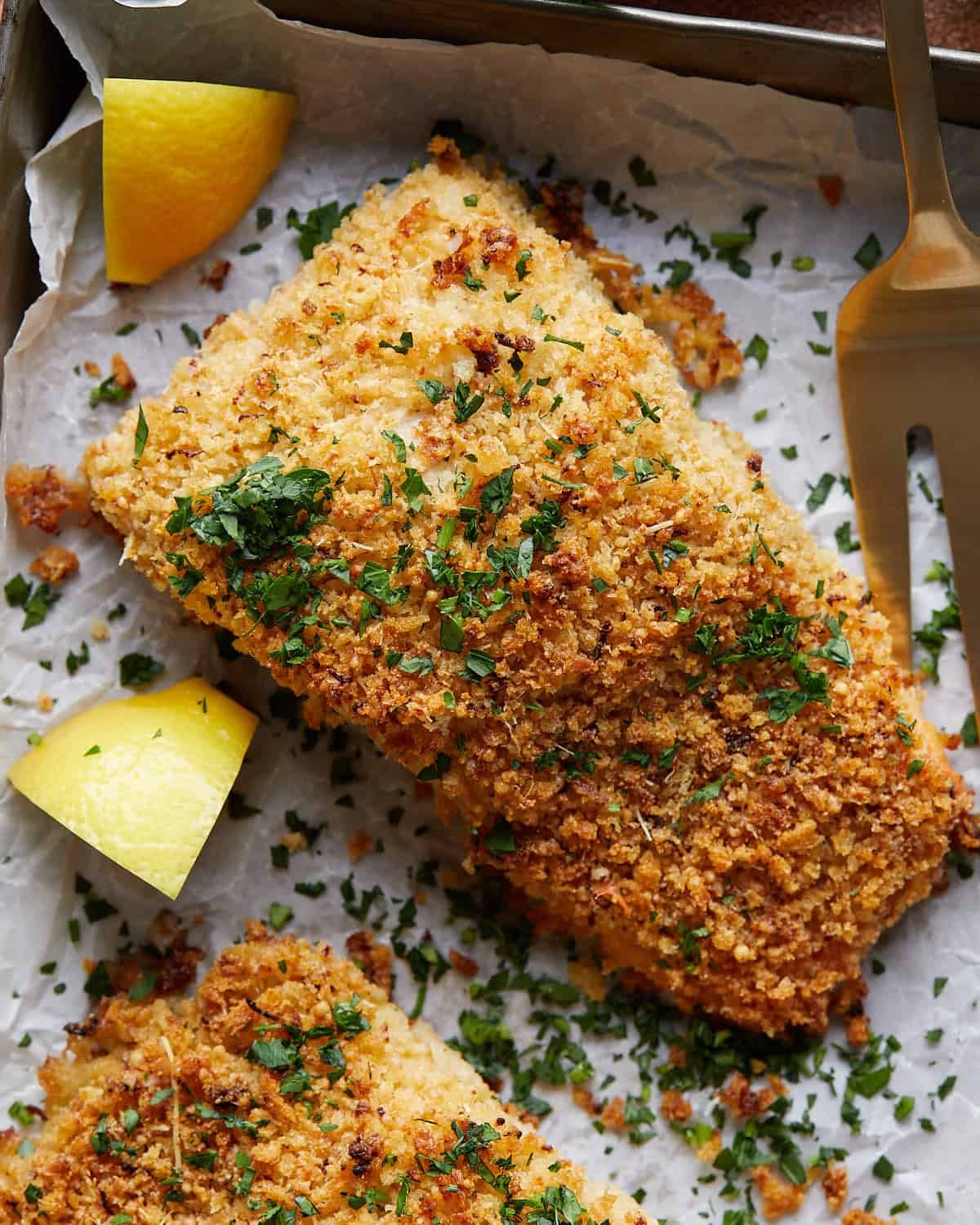 Up close image of panko crusted salmon with garnish.