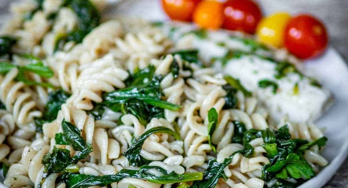 Up close image of sautéed spinach pasta.