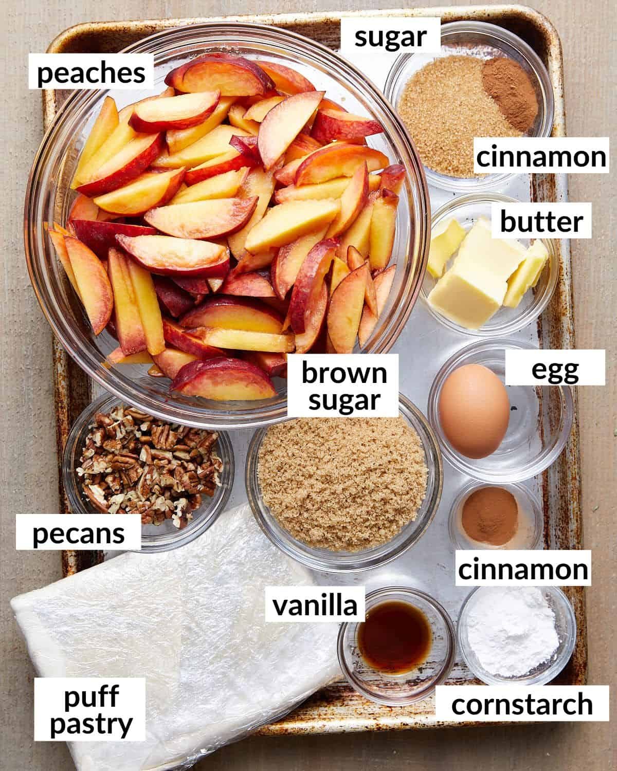 Overhead image of ingredients needed for peach cobbler with puff pastry.