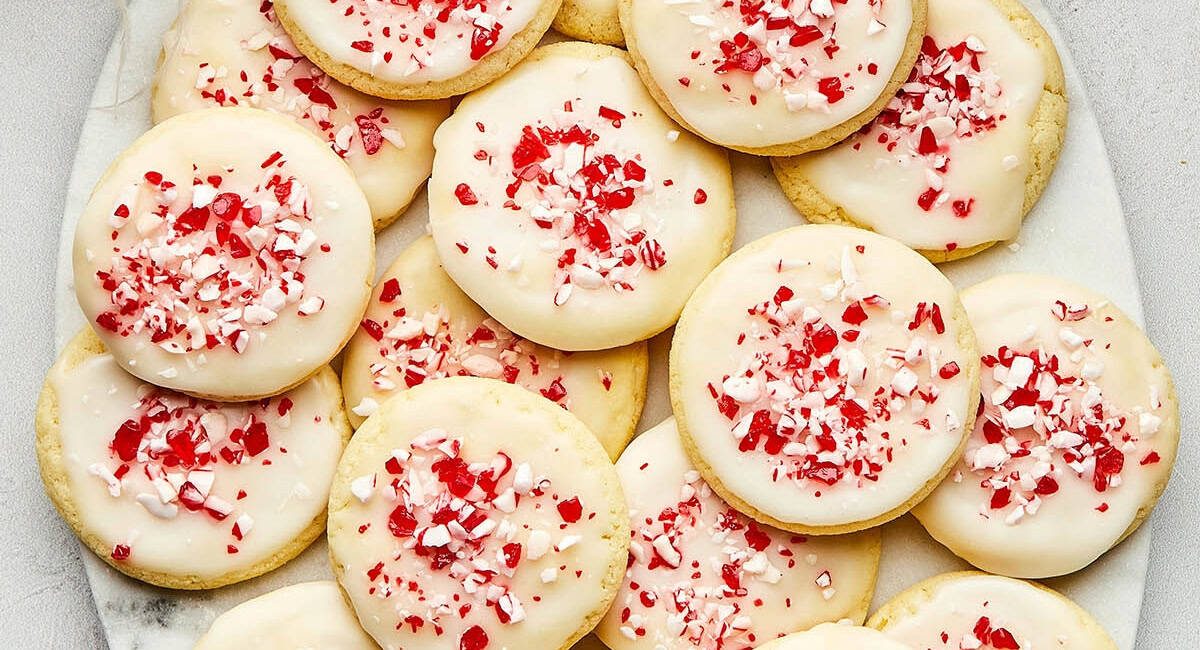 Overhead image of peppermint sugar cookies on white dish.