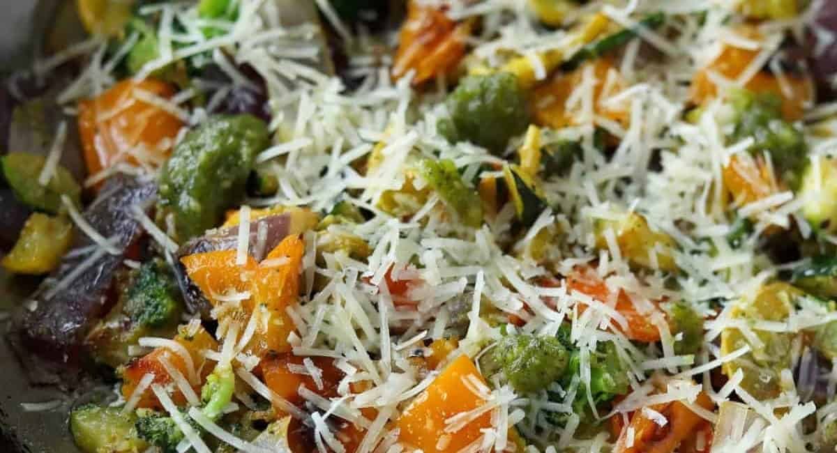 Up close image of pesto veggies recipe with garnish.