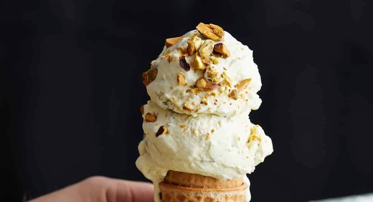 Up close image of pistachio ice cream with garnish.
